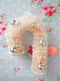 Ivory Frosted Bottle Brush Candy Cane Ornament